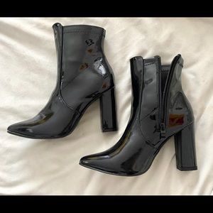 Black slick ankle boots